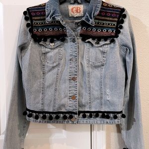 Upcycled denim jacket with tassels and embellishment. Size small.